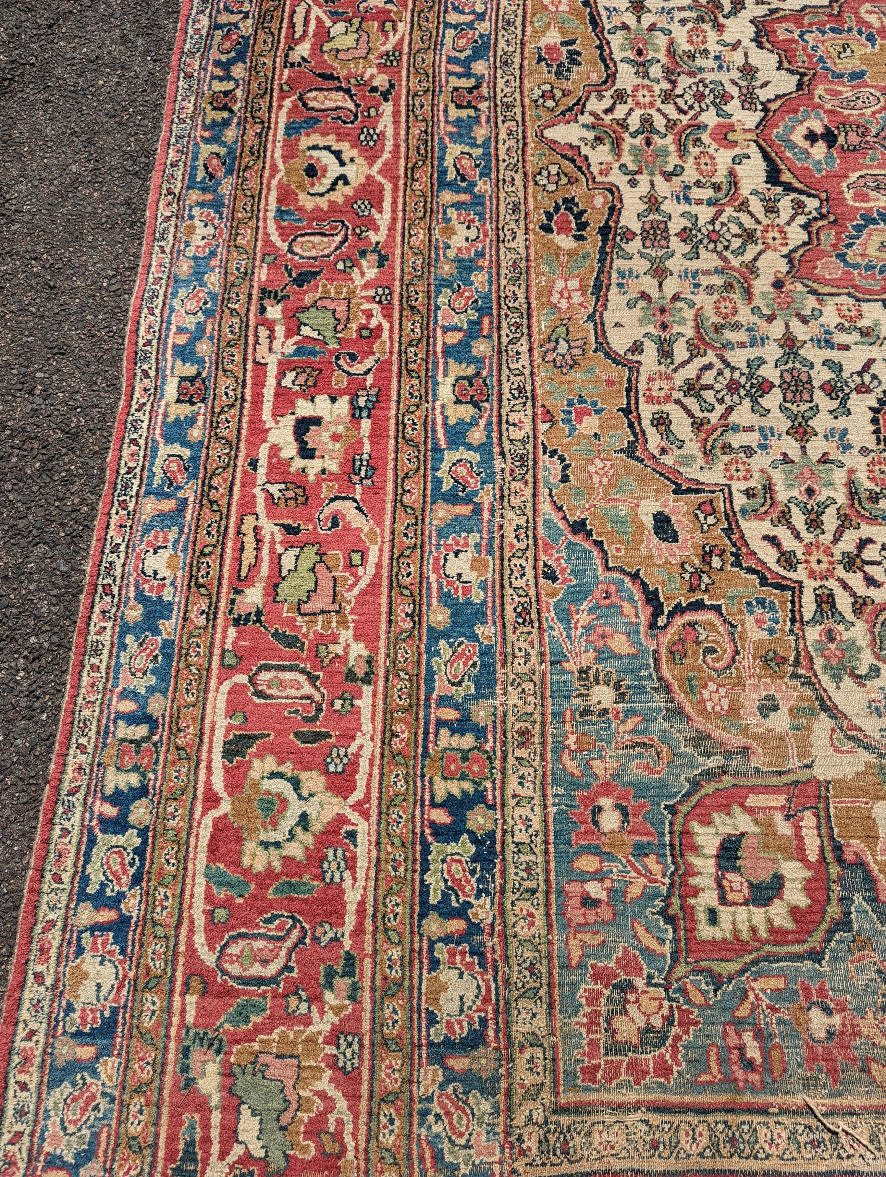 An Isfahan ivory ground carpet, 432 x 330cm
